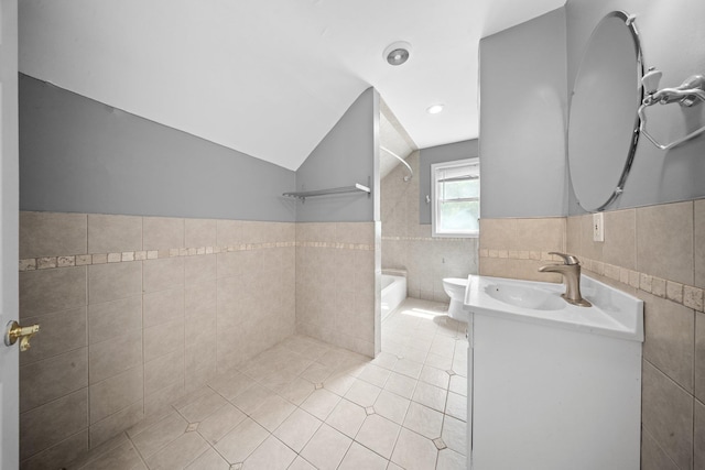 199 Central Ave, Bethpage, NY 11714 - bathroom featuring tile walls, tile patterned flooring, washtub / shower combination, vaulted ceiling, and vanity