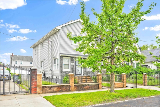 187-16 Williamson Ave, Springfield Gardens, NY 11413 - view of front of home featuring a gate and a fenced front yard