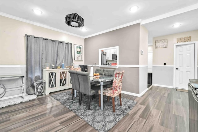 187-16 Williamson Ave, Springfield Gardens, NY 11413 - dining space featuring wood finished floors, ornamental molding, recessed lighting, and baseboards