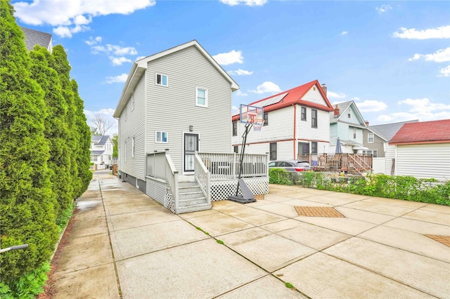 187-16 Williamson Ave, Springfield Gardens, NY 11413 - rear view of property with a patio area, a wooden deck, and a residential view