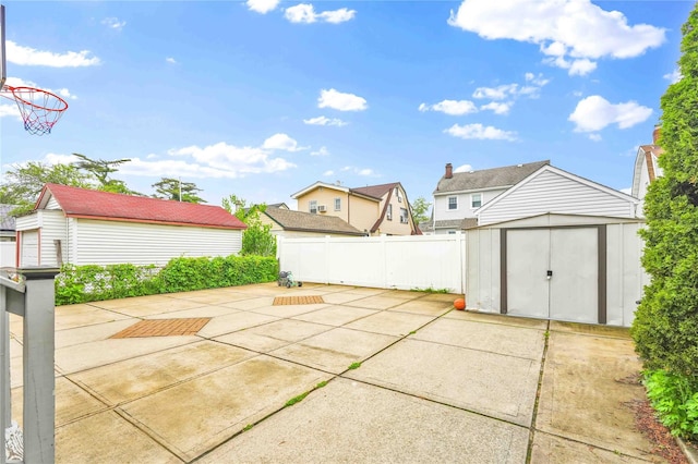 187-16 Williamson Ave, Springfield Gardens, NY 11413 - view of patio / terrace featuring an outdoor structure, fence, and a shed