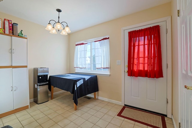 601 Covington Green Ln, Patterson, NY 12563 - foyer with a chandelier and light tile patterned floors