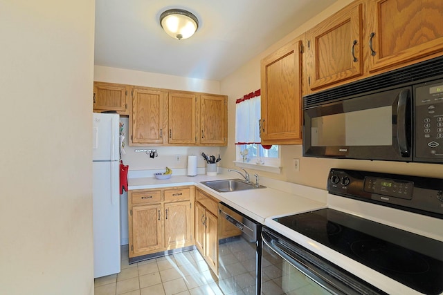 601 Covington Green Ln, Patterson, NY 12563 - kitchen featuring range with electric stovetop, dishwashing machine, black microwave, freestanding refrigerator, and light countertops