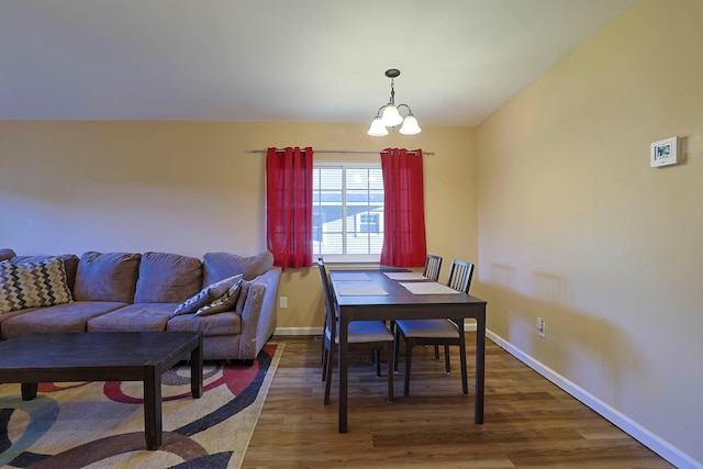 601 Covington Green Ln, Patterson, NY 12563 - dining room with a chandelier and wood finished floors