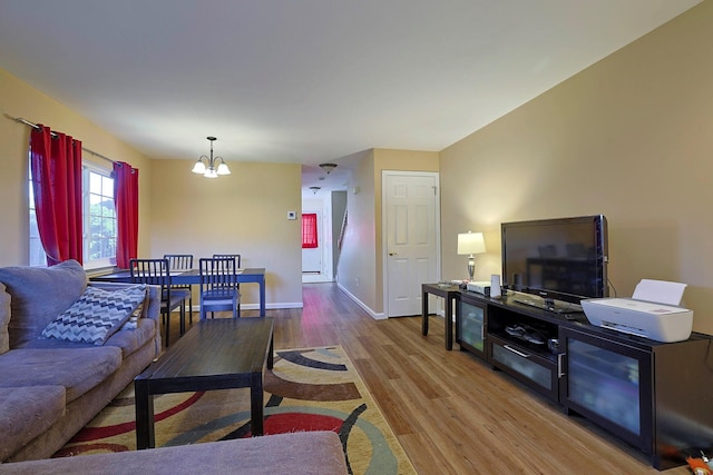 601 Covington Green Ln, Patterson, NY 12563 - living room with wood finished floors and a chandelier