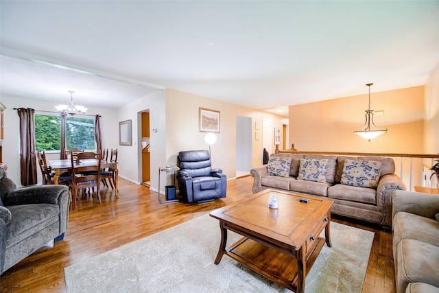 7 Ross Ln, Middletown, NY 10941 - living room featuring a chandelier and wood finished floors