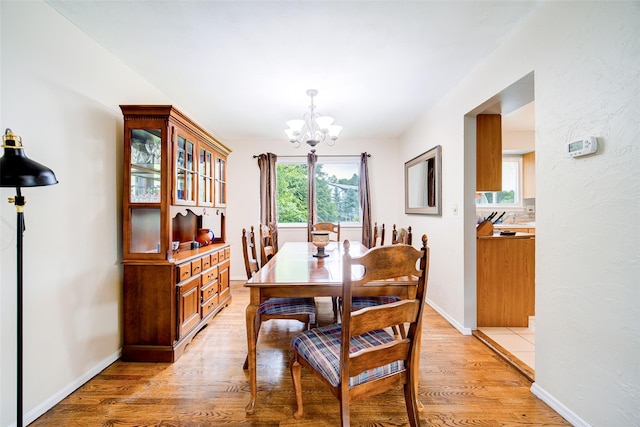7 Ross Ln, Middletown, NY 10941 - dining area with a chandelier and light wood-style flooring
