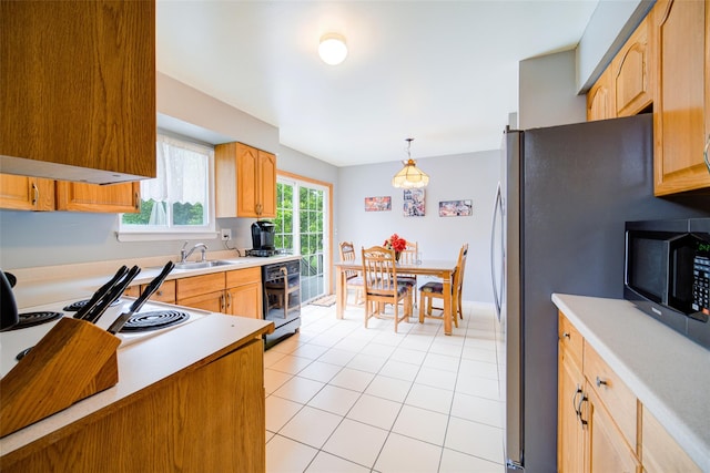 7 Ross Ln, Middletown, NY 10941 - kitchen with black appliances, light countertops, light tile patterned flooring, decorative light fixtures, and light brown cabinetry