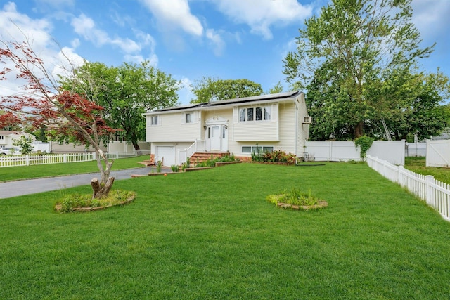 23 Berkeley Ave, Selden, NY 11784 - raised ranch featuring an attached garage and driveway