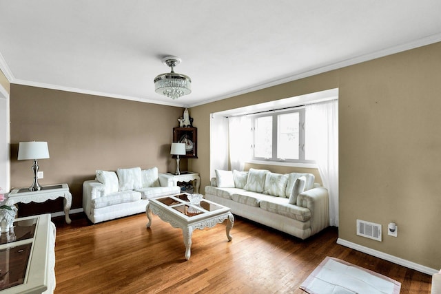 23 Berkeley Ave, Selden, NY 11784 - living area featuring crown molding, wood finished floors, and baseboards