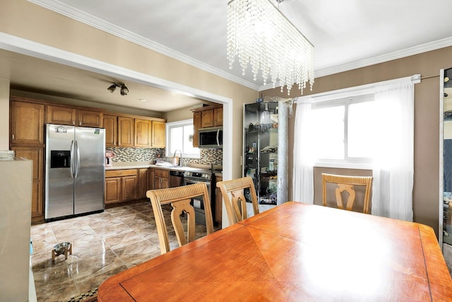 23 Berkeley Ave, Selden, NY 11784 - dining space with a chandelier and crown molding