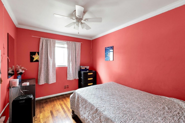 23 Berkeley Ave, Selden, NY 11784 - bedroom featuring wood finished floors, baseboards, crown molding, and ceiling fan
