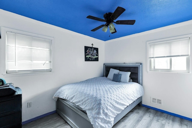 23 Berkeley Ave, Selden, NY 11784 - bedroom with wood finished floors, baseboards, a ceiling fan, and crown molding