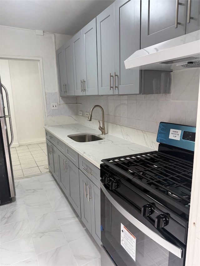 44-11 Macnish St Unit 1E, Elmhurst, NY 11373 - kitchen featuring range with gas stovetop, a sink, under cabinet range hood, and gray cabinets