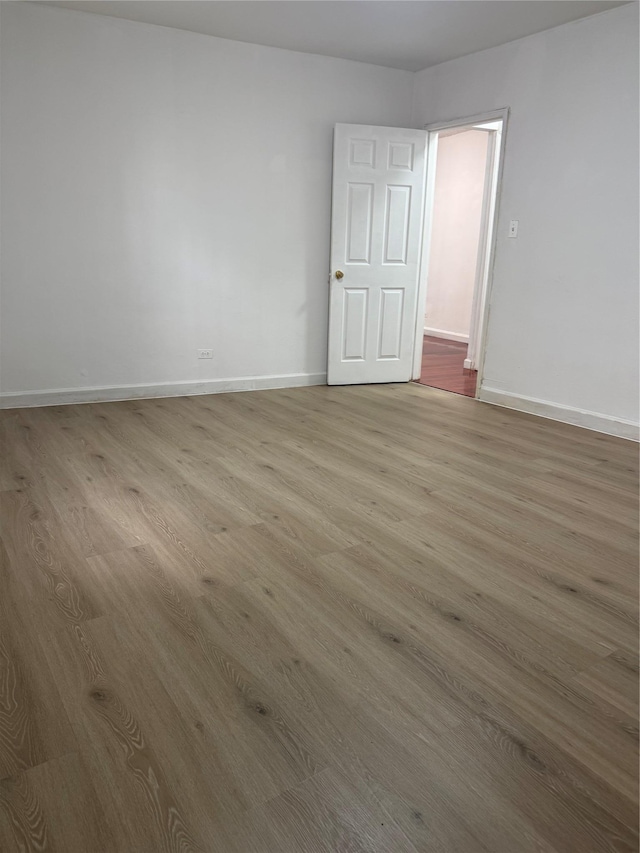 44-11 Macnish St Unit 1E, Elmhurst, NY 11373 - empty room featuring wood finished floors and baseboards