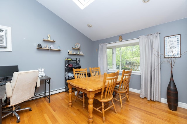 449 Terry Blvd, Holbrook, NY 11741 - dining area with light wood-style floors, vaulted ceiling, an office area, a skylight, and baseboards