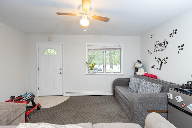 449 Terry Blvd, Holbrook, NY 11741 - living area featuring a baseboard heating unit, light tile patterned floors, and a ceiling fan