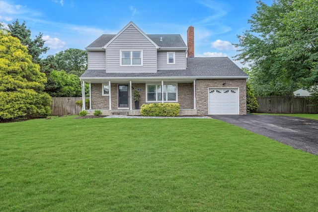 5 Michelle Ln, Selden, NY 11784 - traditional home with an attached garage, asphalt driveway, a chimney, stone siding, and covered porch