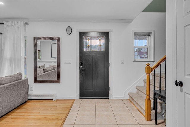 5 Michelle Ln, Selden, NY 11784 - entryway featuring stairway, wood finished floors, and crown molding