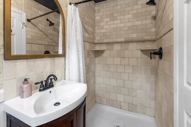5 Michelle Ln, Selden, NY 11784 - bathroom featuring tiled shower, vanity, tasteful backsplash, and tile walls