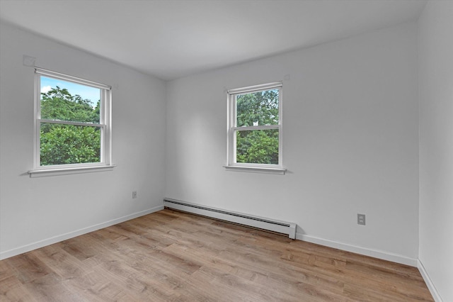 5 Michelle Ln, Selden, NY 11784 - spare room with a baseboard radiator and wood finished floors
