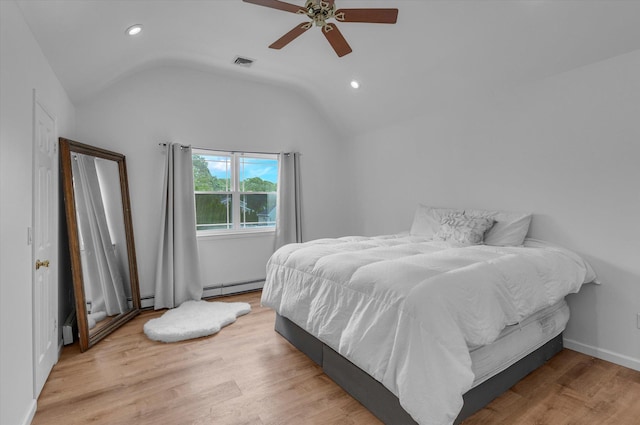 5 Michelle Ln, Selden, NY 11784 - bedroom featuring baseboard heating, vaulted ceiling, recessed lighting, wood finished floors, and ceiling fan