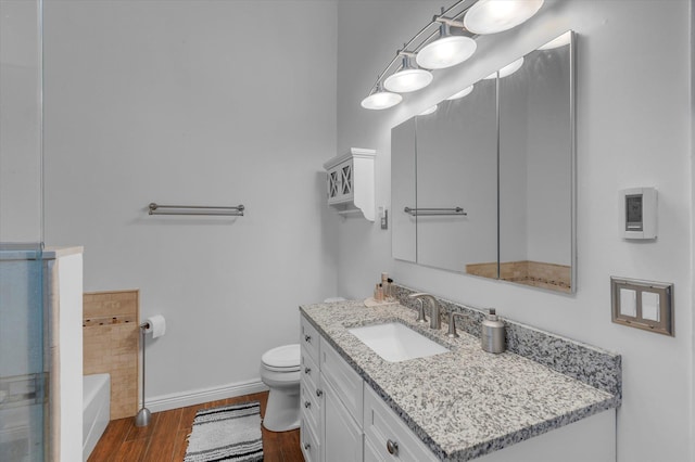 5 Michelle Ln, Selden, NY 11784 - bathroom featuring wood finished floors, vanity, and a tub
