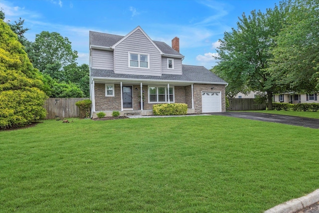 5 Michelle Ln, Selden, NY 11784 - traditional-style house featuring asphalt driveway, a chimney, a garage, roof with shingles, and covered porch