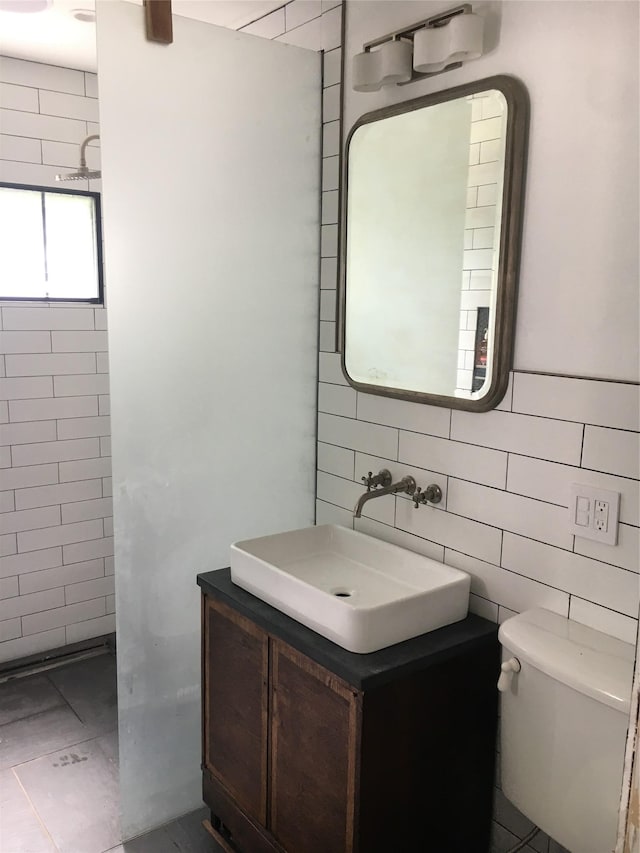 2 Lincoln Ter, Newburgh, NY 12550 - full bathroom featuring tile walls, a tile shower, vanity, and toilet