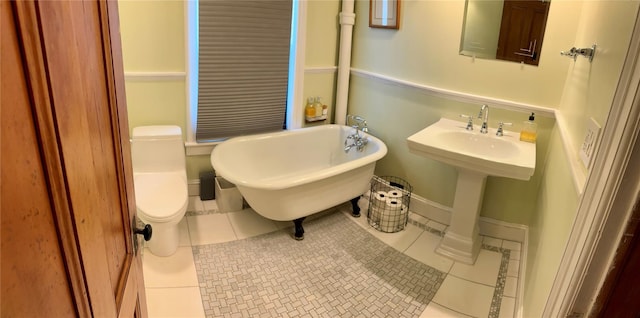 2 Lincoln Ter, Newburgh, NY 12550 - bathroom featuring a soaking tub, tile patterned flooring, and toilet