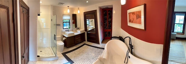 2 Lincoln Ter, Newburgh, NY 12550 - full bath featuring radiator heating unit, a stall shower, vanity, and a soaking tub