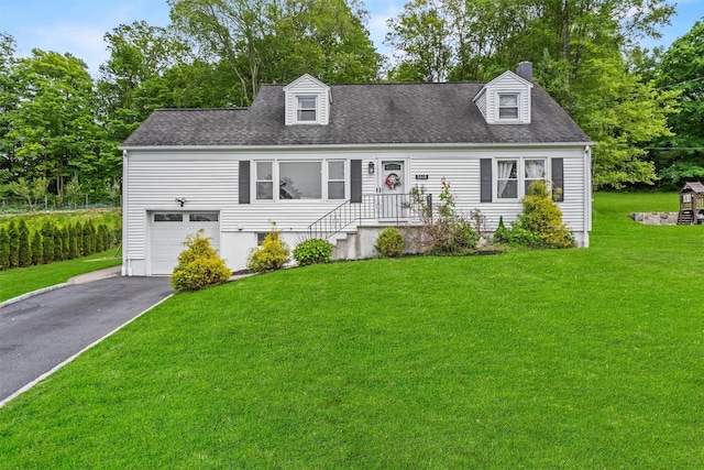 3518 Overlook Ave, Yorktown Heights, NY 10598 - cape cod-style house with asphalt driveway, an attached garage, a chimney, a front lawn, and roof with shingles