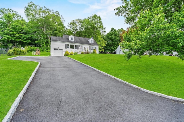 3518 Overlook Ave, Yorktown Heights, NY 10598 - cape cod home with an attached garage, driveway, and a front lawn