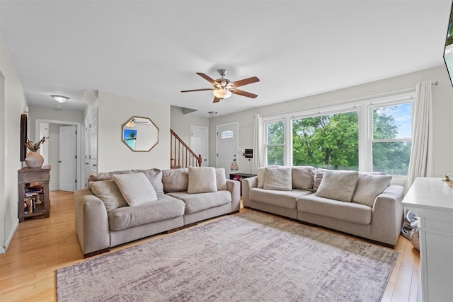 3518 Overlook Ave, Yorktown Heights, NY 10598 - living area with light wood-style floors, a ceiling fan, and stairs