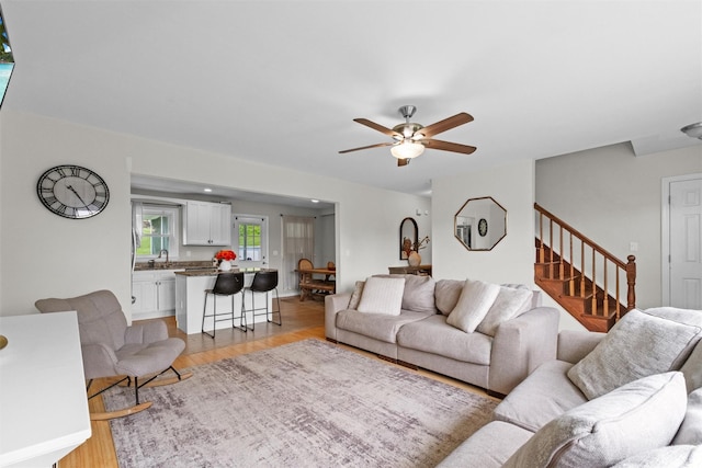 3518 Overlook Ave, Yorktown Heights, NY 10598 - living area with stairway, ceiling fan, and light wood finished floors