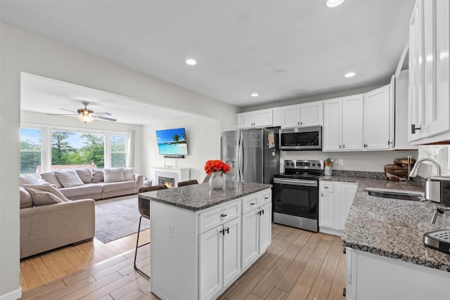 3518 Overlook Ave, Yorktown Heights, NY 10598 - kitchen featuring stainless steel appliances, white cabinetry, and recessed lighting
