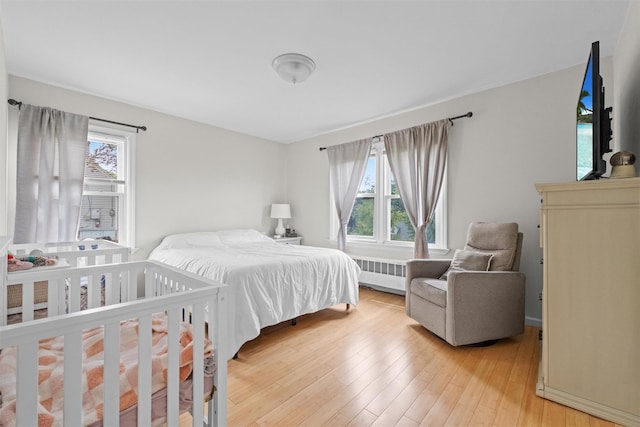 3518 Overlook Ave, Yorktown Heights, NY 10598 - bedroom featuring radiator heating unit and light wood finished floors