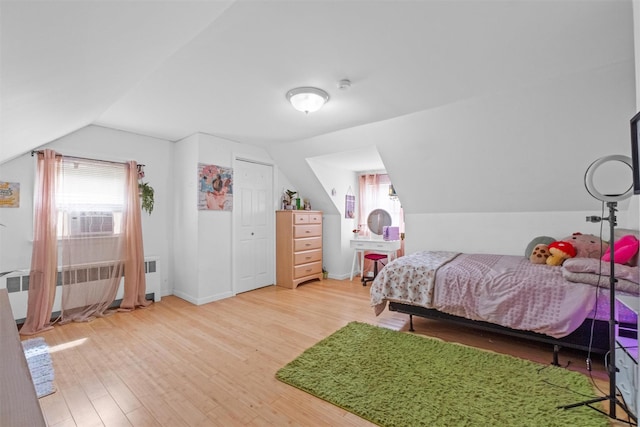 3518 Overlook Ave, Yorktown Heights, NY 10598 - bedroom with radiator heating unit, lofted ceiling, wood finished floors, cooling unit, and baseboards