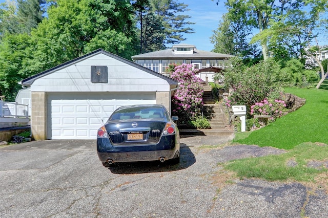 5 The Promenade, Glen Head, NY 11545 - view of front of property with stairway, an outbuilding, and a garage