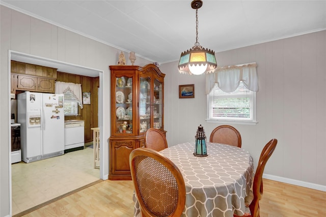 5 The Promenade, Glen Head, NY 11545 - dining space featuring light wood-style floors, ornamental molding, and baseboards