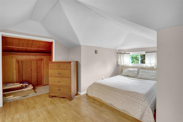 5 The Promenade, Glen Head, NY 11545 - bedroom with lofted ceiling, light wood-type flooring, and baseboards