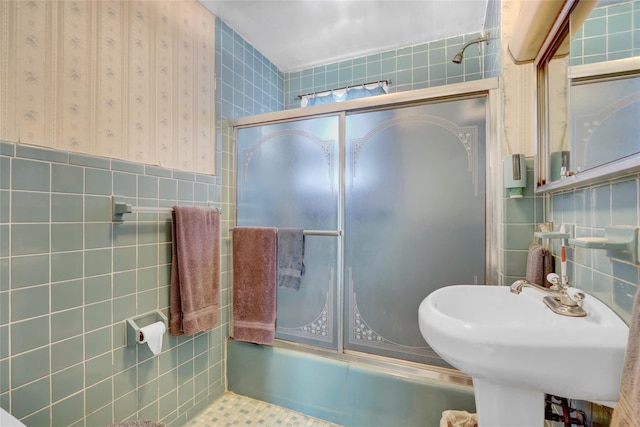 5 The Promenade, Glen Head, NY 11545 - bathroom with tile walls, combined bath / shower with glass door, and a sink