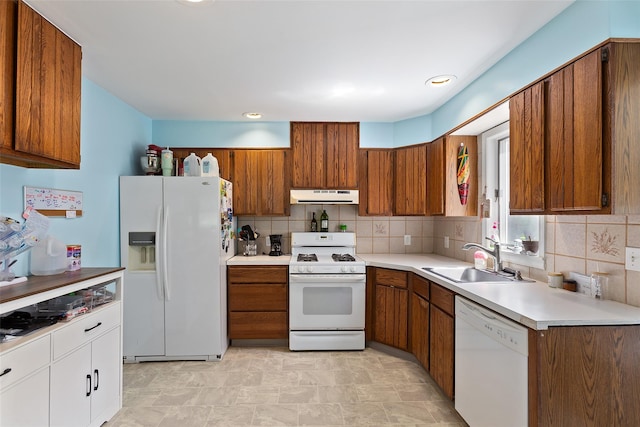 420 Fourth Rd, Wappingers Falls, NY 12590 - kitchen with white appliances, exhaust hood, a sink, brown cabinetry, and backsplash
