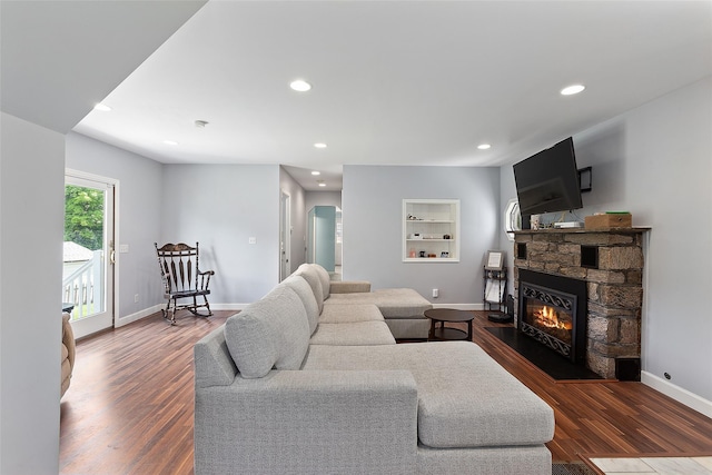 420 Fourth Rd, Wappingers Falls, NY 12590 - living room with a stone fireplace, recessed lighting, baseboards, wood finished floors, and built in features