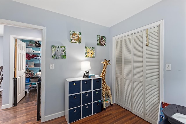 420 Fourth Rd, Wappingers Falls, NY 12590 - bedroom with dark wood-type flooring, a closet, and baseboards