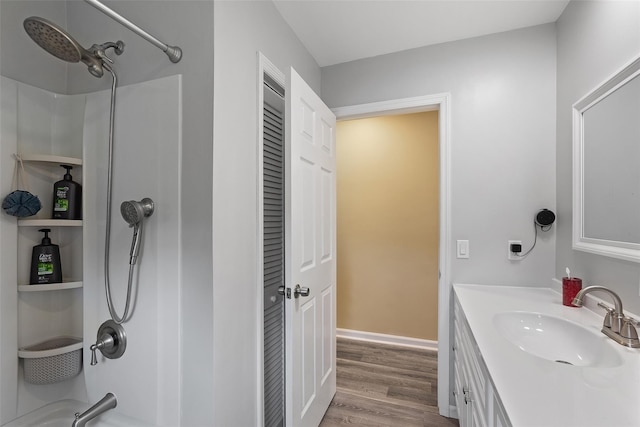 420 Fourth Rd, Wappingers Falls, NY 12590 - full bath featuring wood finished floors, vanity, and tub / shower combination