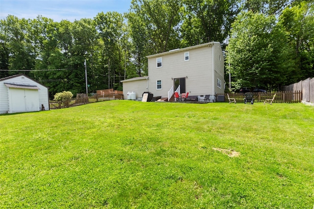 420 Fourth Rd, Wappingers Falls, NY 12590 - back of property with central air condition unit and view of wooded area