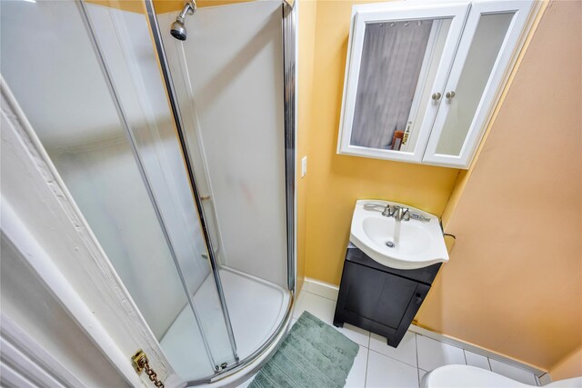 243 Sunflower Ln, Islandia, NY 11749 - bathroom featuring a stall shower, tile patterned floors, baseboards, and vanity