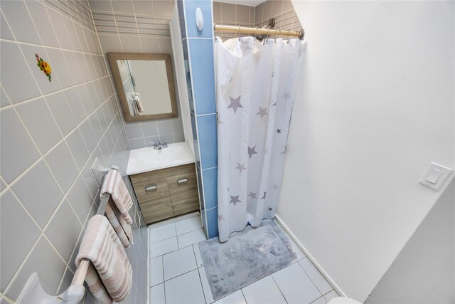 243 Sunflower Ln, Islandia, NY 11749 - bathroom with tile walls, tile patterned flooring, vanity, and a shower with shower curtain