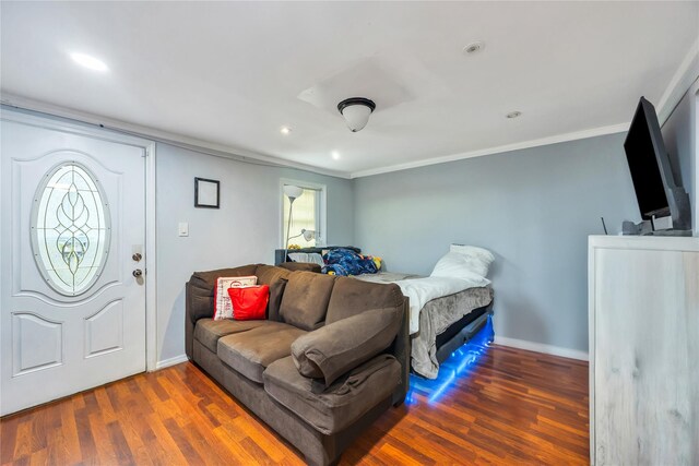 243 Sunflower Ln, Islandia, NY 11749 - bedroom with wood finished floors, ornamental molding, recessed lighting, and baseboards